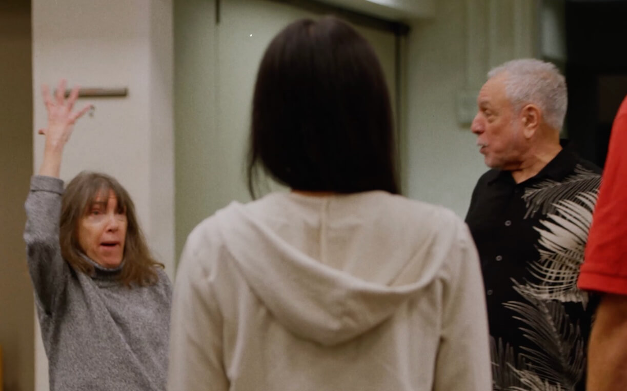 three people interacting in performance