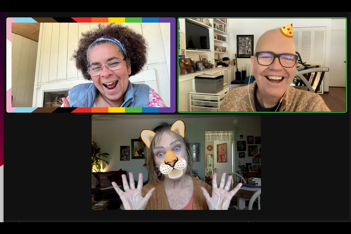 three people in smiling, laughing with silly expressions.